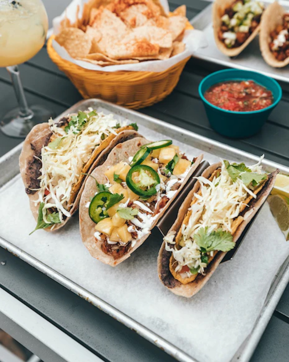 Picture of 3 gluten free taco's and some salsa and chips. 